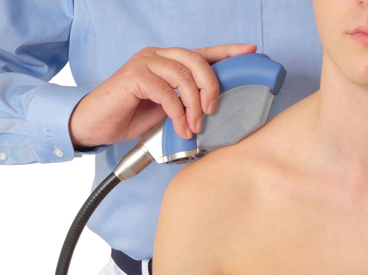 PiezoWave2 Focal Sound Wave handpiece being applied to a patient’s shoulder
